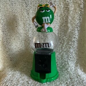 M&M’s green candy dispenser.